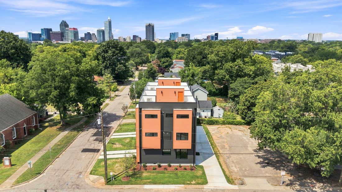 Aerial view of 831 Cotton Place with the downtown Raleigh skyline